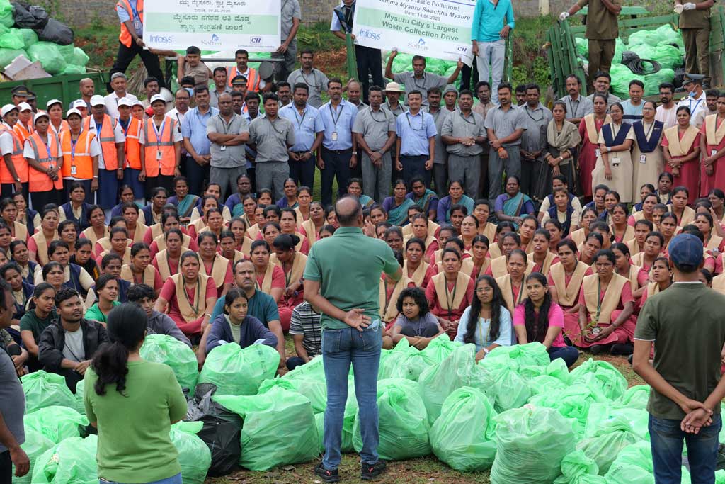 Employees and community members unite to raise awareness on effective waste management.