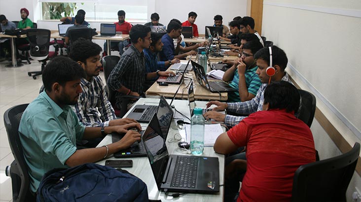 Participants coding during the Hackathon event